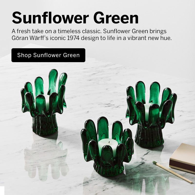 Mobile version image of three green sunflower shaped votives on a marble surface with light background and text explaining Sunflower Green products new introduction, and a button saying 'Shop New Sunflower Green'.